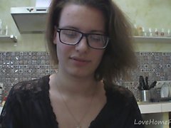 Solo girl with glasses chatting in the kitchen