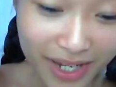 cute Asian takes cock in the ass on cam