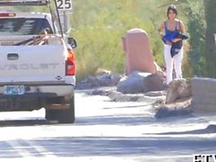 Busty babe gets naked on a highway