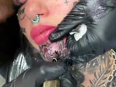 Australian bombshell Amber Luke gets a new chin tattoo