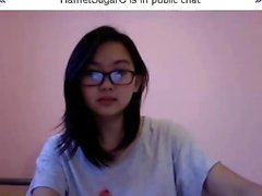 Young and pretty Asian nerd offers a sexy sneak peek of her