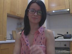 Splendid teen with glasses chatting in the kitchen