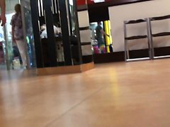 Asian women being watched through cam while trying on shoes