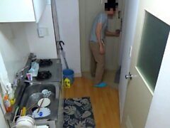 Japanese milf gives horny dude a hot blowjob in the kitchen