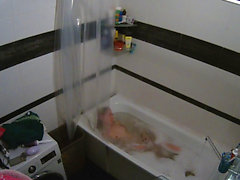 Hot european girl in bath uses shower head to masturbate