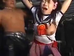 Busty Asian babe is strung up and tortured so hard she pass