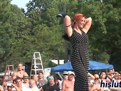 Ravishing redhead performs striptease in public