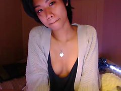 Asian teen plays with toys on webcam