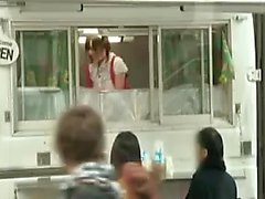 Cute Japanese babe in a food truck gets her pussy fingered