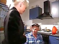 Horny blonde granny blows the repairman and gets banged in the kitchen