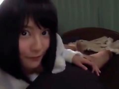 Asian girl gives a handjob and blowjob to a tied up guy