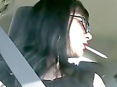 Sexy Mina smoking in the car