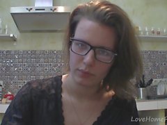 Solo girl with glasses chatting in the kitchen