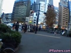 Naughty Asian girl is pissing in public